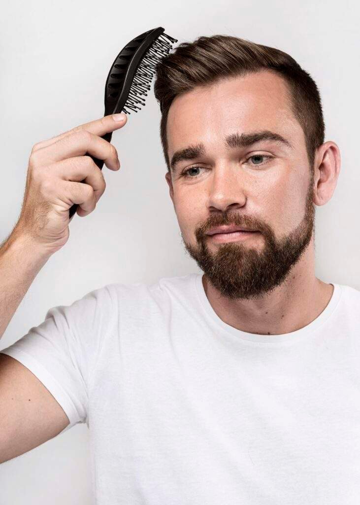 smiley man brushing his hair